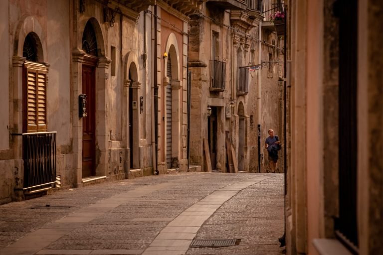 Streets of Sicily with man walking in distance