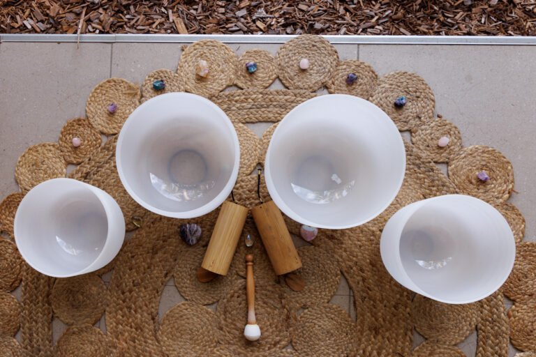 Close up photo of sound bowls, and chakra stones for wellness branding photos