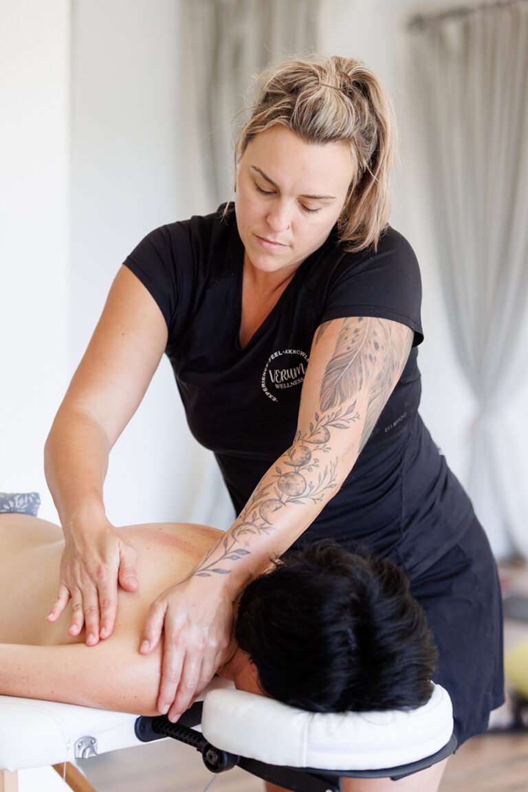 Female Kahuna massage therapist during massage for personal branding and wellness branding photos